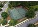 Aerial view of the community tennis courts surrounded by lush greenery at 218 Ballymore Lane Ln, Acworth, GA 30102