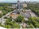 Aerial view of home in Atlanta, Georgia surrounded by lush trees and businesses at 28 Peachtree Hills Ne Ave, Atlanta, GA 30305