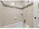 Cozy bathroom with ceramic tile walls and a built in storage cabinet at 28 Peachtree Hills Ne Ave, Atlanta, GA 30305