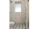 Shower showcasing tiled walls, niche shelving, rainfall shower head, and decorative tile floor at 28 Peachtree Hills Ne Ave, Atlanta, GA 30305