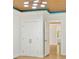 Spacious bedroom with a tray ceiling and built in storage with a view into the backyard at 28 Peachtree Hills Ne Ave, Atlanta, GA 30305