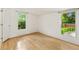 Bright bedroom with hardwood floors, white walls, and natural light through windows at 28 Peachtree Hills Ne Ave, Atlanta, GA 30305