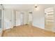 Well-lit bedroom with hardwood floors, multiple closets and an ensuite bathroom at 28 Peachtree Hills Ne Ave, Atlanta, GA 30305