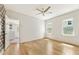 Bright bedroom with hardwood floors, white walls, and natural light streaming through large windows at 28 Peachtree Hills Ne Ave, Atlanta, GA 30305