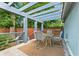Outdoor deck with seating, a pergola, and a peaceful view of the surrounding greenery at 28 Peachtree Hills Ne Ave, Atlanta, GA 30305