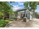 Charming home featuring a pergola-covered porch, well-maintained landscaping, and a welcoming entrance at 28 Peachtree Hills Ne Ave, Atlanta, GA 30305