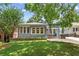 Charming single-story home with a well-manicured lawn and inviting front porch at 28 Peachtree Hills Ne Ave, Atlanta, GA 30305