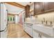 Modern kitchen with white cabinetry, stainless steel appliances, and hardwood floors at 28 Peachtree Hills Ne Ave, Atlanta, GA 30305