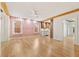 Bright living room featuring hardwood floors, exposed beams, and stylish pink accent wall at 28 Peachtree Hills Ne Ave, Atlanta, GA 30305