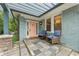 Inviting front porch with stylish seating and a pergola, perfect for relaxing outdoors at 28 Peachtree Hills Ne Ave, Atlanta, GA 30305