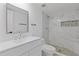 Modern bathroom featuring marble-style tiled walls, a sleek sink, and a luxurious, glass-enclosed shower at 3236 Henderson Mill Rd # 1, Chamblee, GA 30341