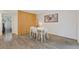 Dining room with hardwood floors, a unique wood slat wall, and a table set for four at 3236 Henderson Mill Rd # 1, Chamblee, GA 30341