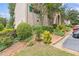 Exterior of a multi-story condo building with well-maintained landscaping and parking at 3236 Henderson Mill Rd # 1, Chamblee, GA 30341