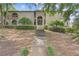 Inviting two-story condo with unique architecture, landscaping, and grand entrance staircase at 3236 Henderson Mill Rd # 1, Chamblee, GA 30341