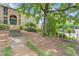 Condominium exterior with lush landscaping, steps leading to the entrance, and a glimpse of the community pool at 3236 Henderson Mill Rd # 1, Chamblee, GA 30341