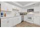 Modern kitchen with white cabinetry, stainless steel appliances, and sleek countertops is move in ready at 3236 Henderson Mill Rd # 1, Chamblee, GA 30341