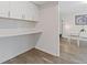 Bright kitchen area with white cabinets and countertops, with a pass-through to the dining room at 3236 Henderson Mill Rd # 1, Chamblee, GA 30341