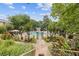 Community pool area with meticulously landscaped gardens and a secure gated entrance for residents' enjoyment at 3236 Henderson Mill Rd # 1, Chamblee, GA 30341