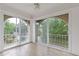 Cozy sunroom with a view to outside, tile flooring and arched windows for ultimate relaxation at 3236 Henderson Mill Rd # 1, Chamblee, GA 30341