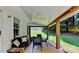 A covered back porch includes a fan and view to the yard at 5385 Spotted Fawn Ct, Suwanee, GA 30024