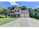 Charming two-story home with a manicured lawn, inviting front porch, and two-car garage at 5385 Spotted Fawn Ct, Suwanee, GA 30024