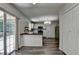 Efficient kitchen with white cabinetry, dark countertops, and stainless steel appliances, perfect for culinary enthusiasts at 5385 Spotted Fawn Ct, Suwanee, GA 30024