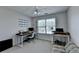 This bright office has two desks with a window view and sitting area at 5385 Spotted Fawn Ct, Suwanee, GA 30024