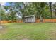 Backyard features a small outbuilding with a porch and a privacy fence at 1272 Sherwood Dr, Norcross, GA 30093