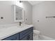 Bathroom with a modern vanity, stylish mirror, and fixtures with contrasting hardware at 1272 Sherwood Dr, Norcross, GA 30093