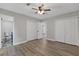 Bedroom with hardwood floors, closet space, and view into a bathroom and hallway at 1272 Sherwood Dr, Norcross, GA 30093