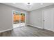 Bright bedroom featuring hardwood floors, a sliding door and neutral paint, perfect for relaxation at 1272 Sherwood Dr, Norcross, GA 30093