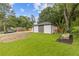 View of the well-maintained backyard showcasing lush greenery and landscaping at 1272 Sherwood Dr, Norcross, GA 30093