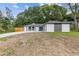 Charming home featuring a blue front door, stylish exterior, and a partially maintained lawn at 1272 Sherwood Dr, Norcross, GA 30093