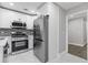Modern kitchen featuring stainless steel appliances, sleek countertops, and ample cabinet space at 1272 Sherwood Dr, Norcross, GA 30093