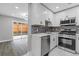 Stylish kitchen featuring stainless steel appliances, granite countertops, and a view to the backyard at 1272 Sherwood Dr, Norcross, GA 30093