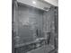 Modern bathroom featuring a glass enclosed shower with dark tile and a rainfall shower head at 1272 Sherwood Dr, Norcross, GA 30093