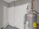 Functional utility room with Rheem Performance water heater and connections for laundry appliances at 1272 Sherwood Dr, Norcross, GA 30093