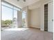 Bright bedroom with large windows, closet and natural light with a view of the outside at 1820 Peachtree Nw St # 608, Atlanta, GA 30309