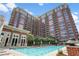 Upscale brick high rise with a large outdoor pool and lounge area at 1820 Peachtree Nw St # 608, Atlanta, GA 30309