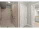 Modern bathroom with a walk-in shower featuring a built-in seat and grab bars at 2845 Echols Road Rd, Cumming, GA 30041