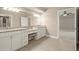 Bright bathroom featuring double sink granite vanity and tile flooring at 2845 Echols Road Rd, Cumming, GA 30041