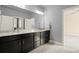 Bathroom featuring a granite countertop, double sink vanity and doorway leading into bedroom at 2845 Echols Road Rd, Cumming, GA 30041