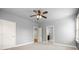 Bright bedroom with neutral paint, carpeted floors, and two doorways at 2845 Echols Road Rd, Cumming, GA 30041