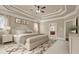 Staged bedroom featuring a trey ceiling, neutral walls, and a view into the en suite bath at 2845 Echols Road Rd, Cumming, GA 30041