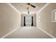 Large bonus room featuring ceiling fans, neutral carpet, and window view at 2845 Echols Road Rd, Cumming, GA 30041