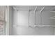 Walk-in closet with white wire shelving system and natural light from the nearby window at 2845 Echols Road Rd, Cumming, GA 30041