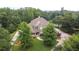 Stunning two-story home with stone accents and a well-manicured lawn surrounded by mature trees at 2845 Echols Road Rd, Cumming, GA 30041
