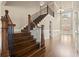 Grand two-story foyer with hardwood floors, staircase, and abundant natural light at 2845 Echols Road Rd, Cumming, GA 30041