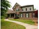 Charming two-story home with a blend of stone and brick, enhanced by a winding walkway and verdant landscaping at 2845 Echols Road Rd, Cumming, GA 30041