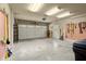 Attached garage with painted concrete floor and ample wall mounted tool storage at 2845 Echols Road Rd, Cumming, GA 30041